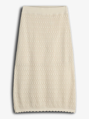 A beige, knee-length knit skirt features a geometric lace pattern, displayed flat against a plain white background.