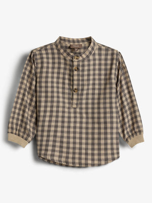 A plaid checkered shirt with long sleeves and a round collar, featuring three brown buttons on the front. The shirt is set against a plain white background.